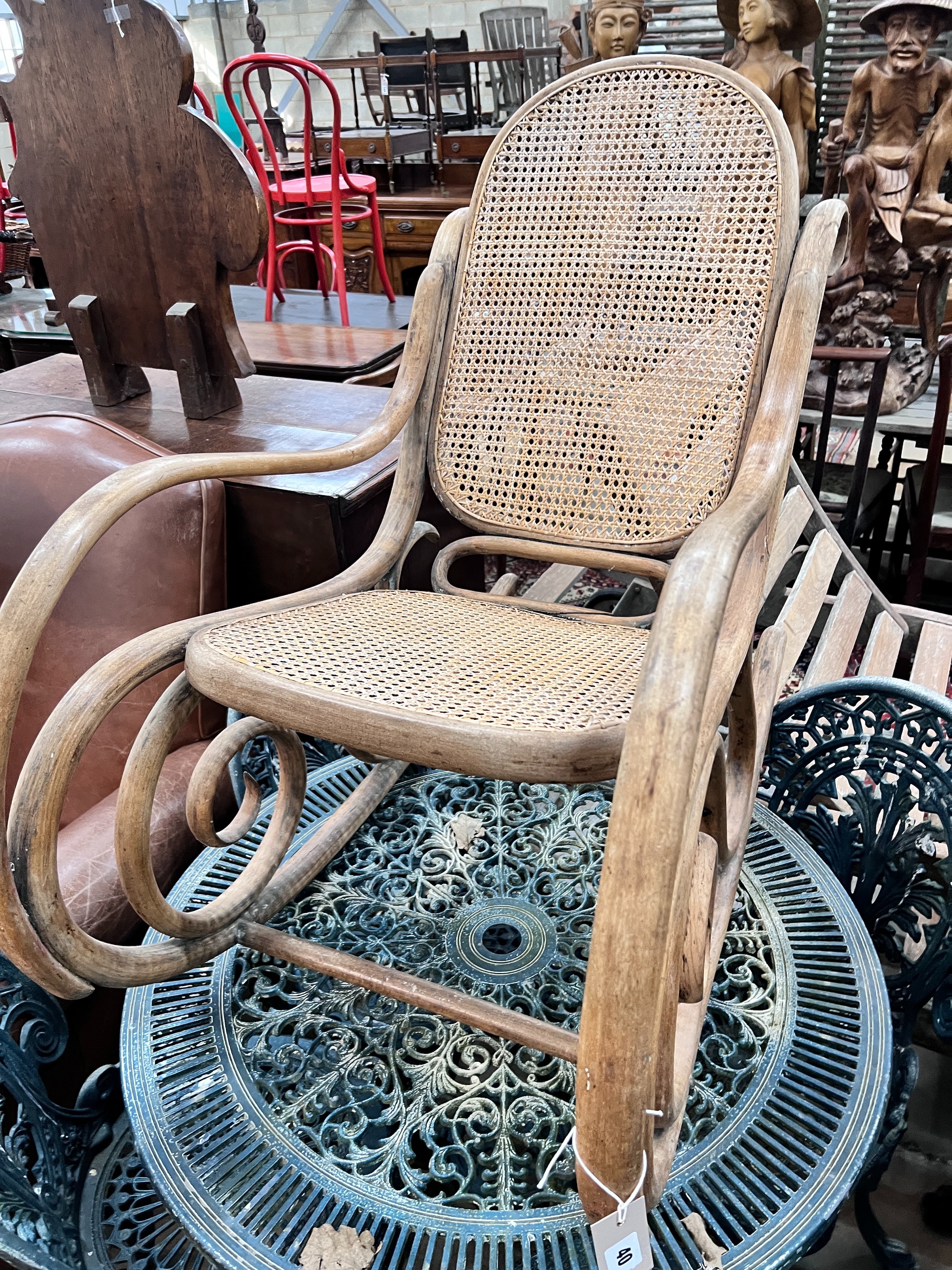 A caned bentwood rocking chair, width 52cm, height 88cm *Please note the sale commences at 9am.